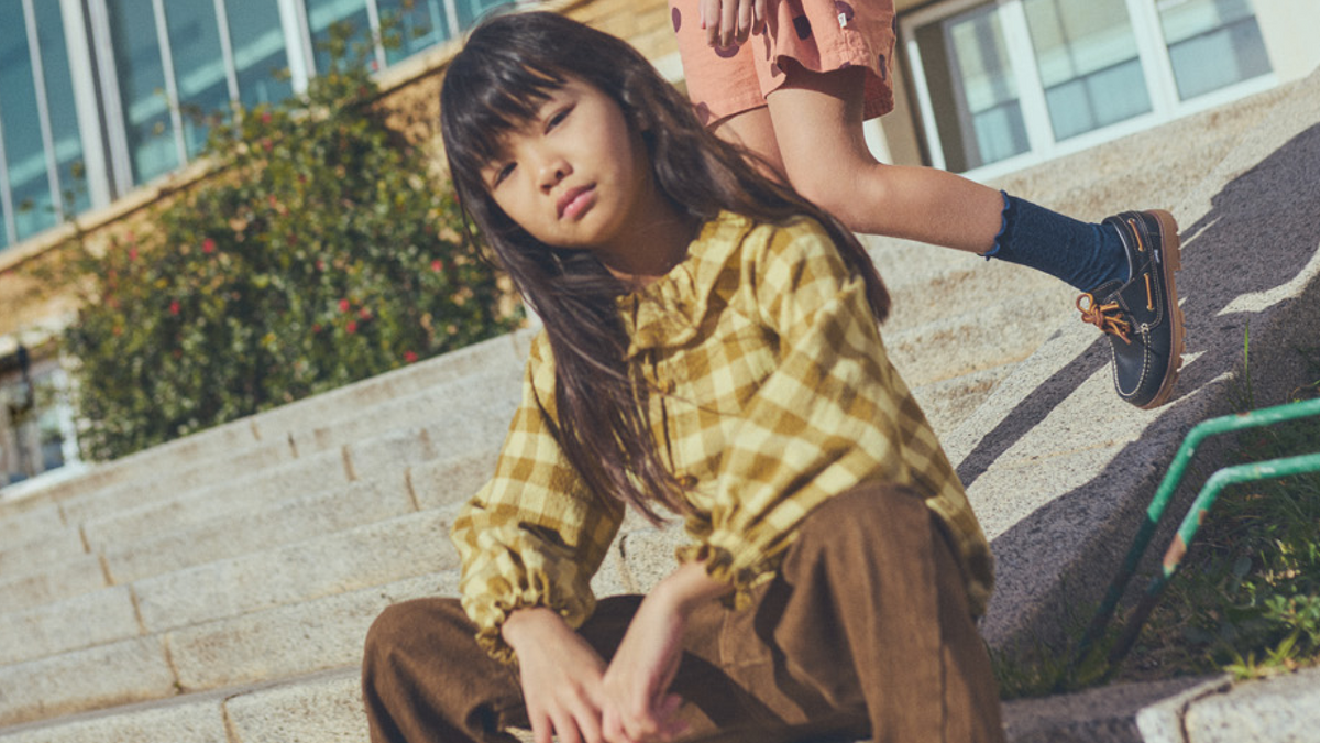 Child in front of city window